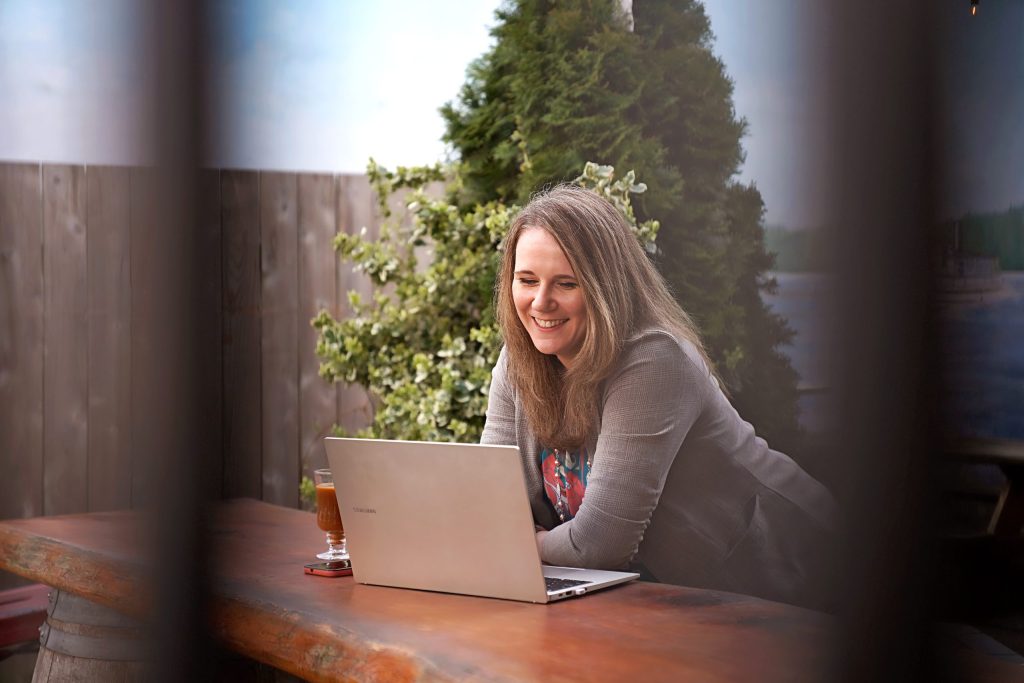 Deborah Rants owner of milestone marketing llc on a computer updating website in port orchard washington